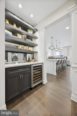 a view of a dining room with furniture large windows and wooden floor