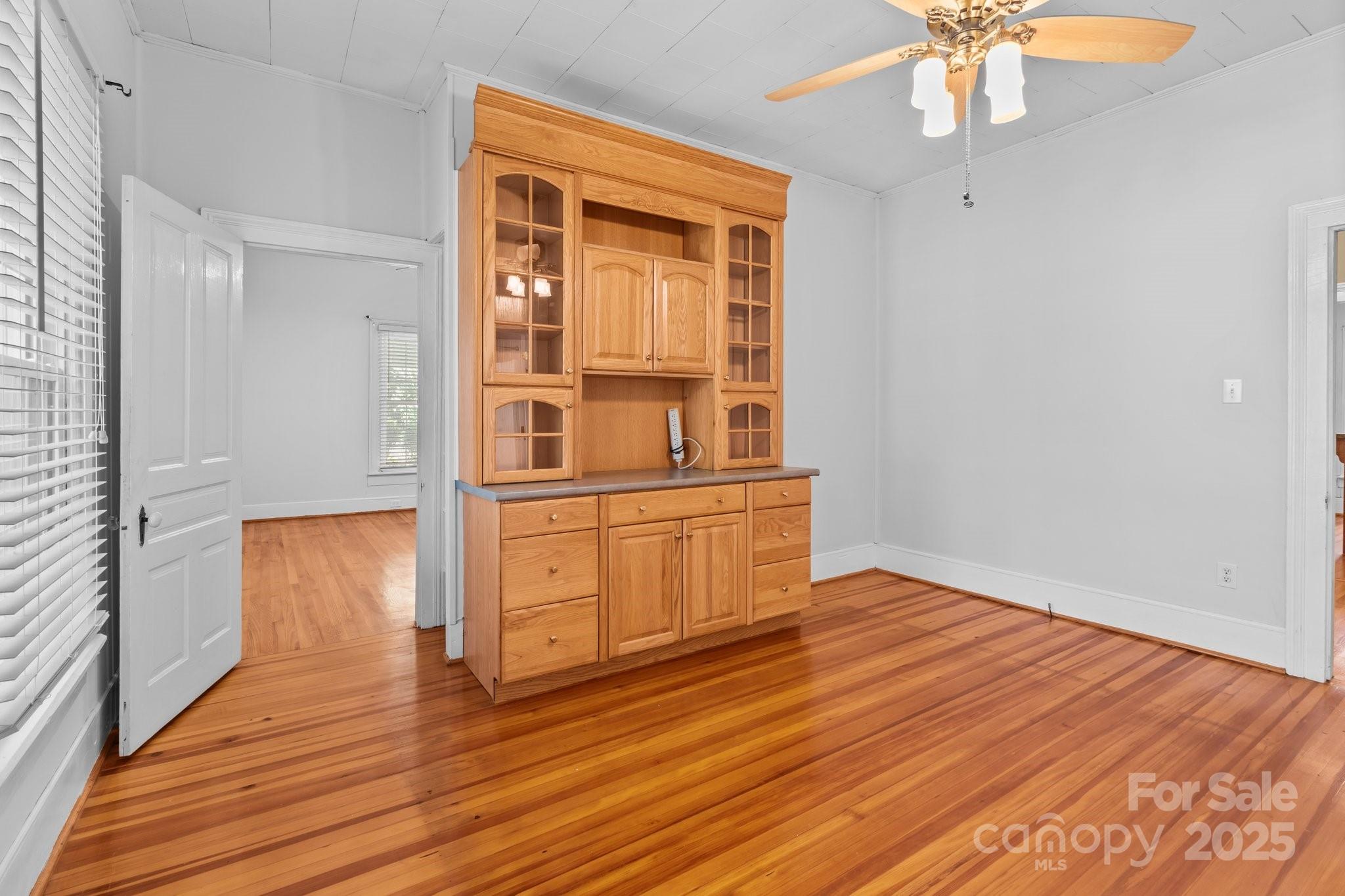 405 7th Street Spencer, NC 28159 - Photo 11 of 39 wooden floor in an empty room with a window