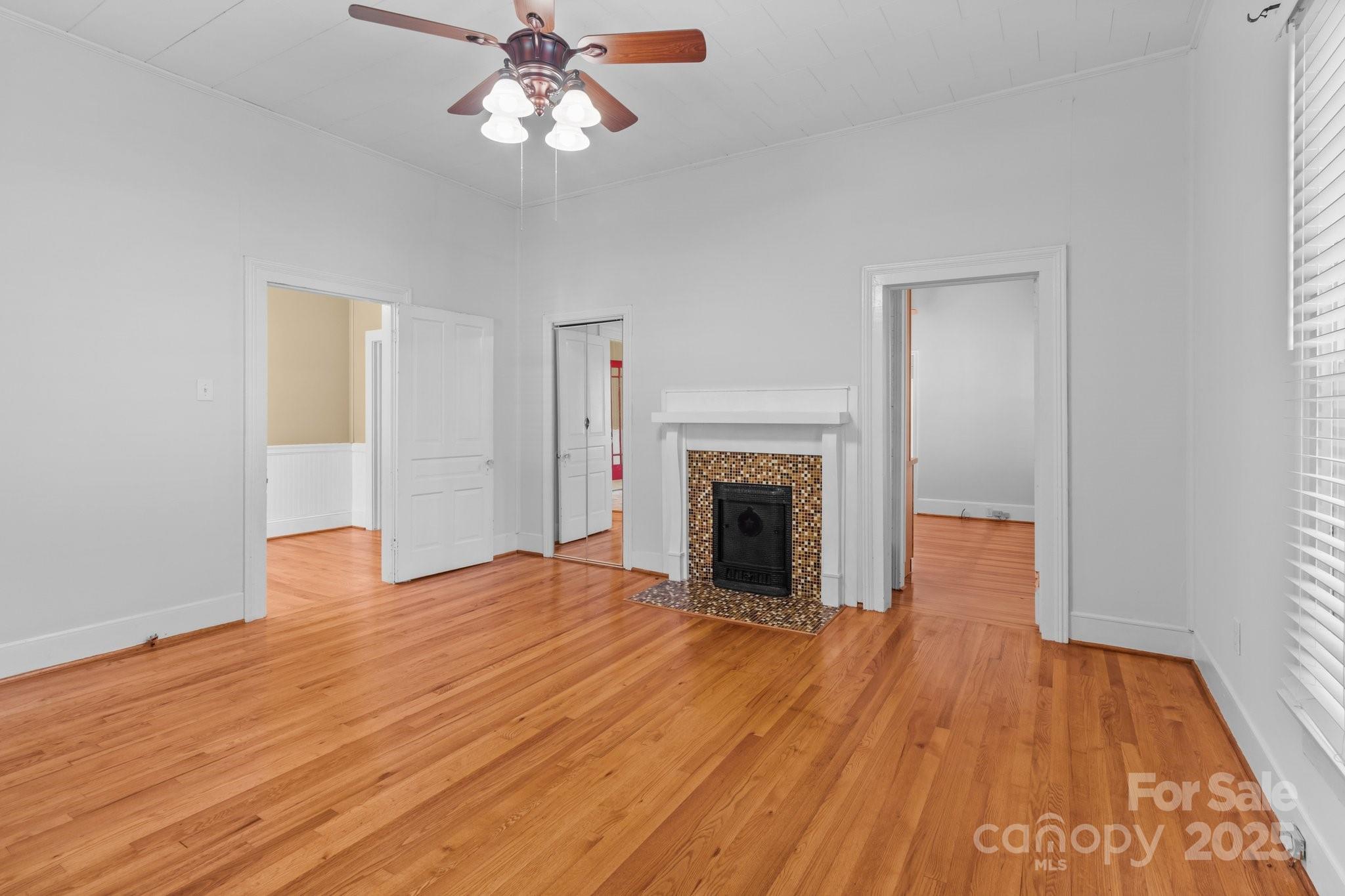 405 7th Street Spencer, NC 28159 - Photo 17 of 39 a view of empty room with wooden floor and fan
