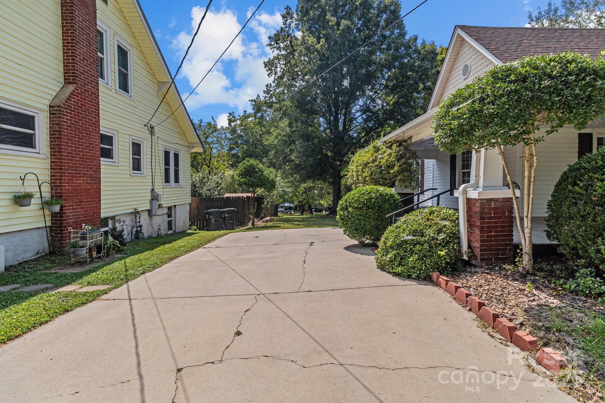 405 7th Street Spencer, NC 28159 - Photo 27 of 39 a view of a yard with potted plants
