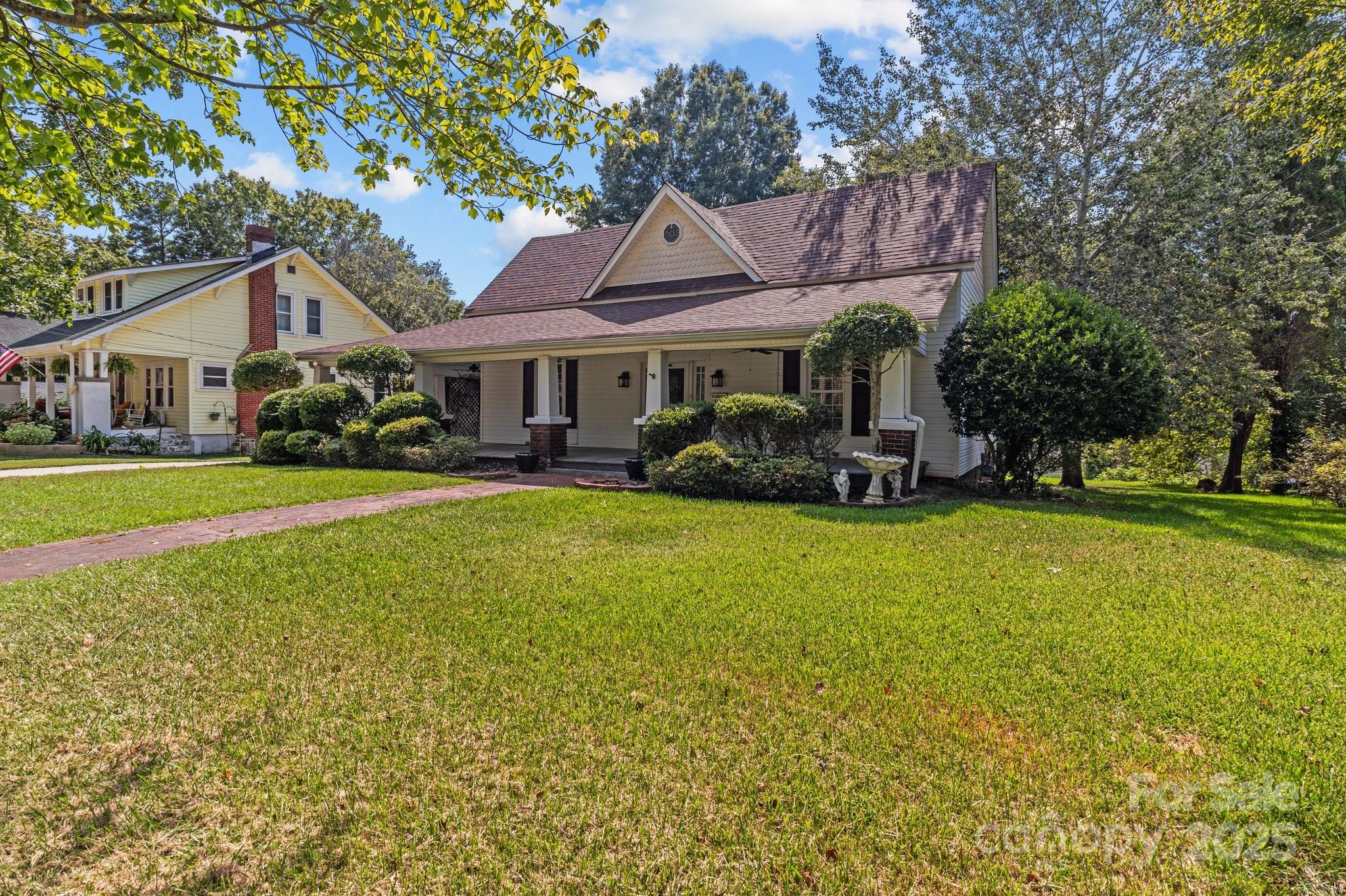 405 7th Street Spencer, NC 28159 - Photo 29 of 39 a front view of a house with garden