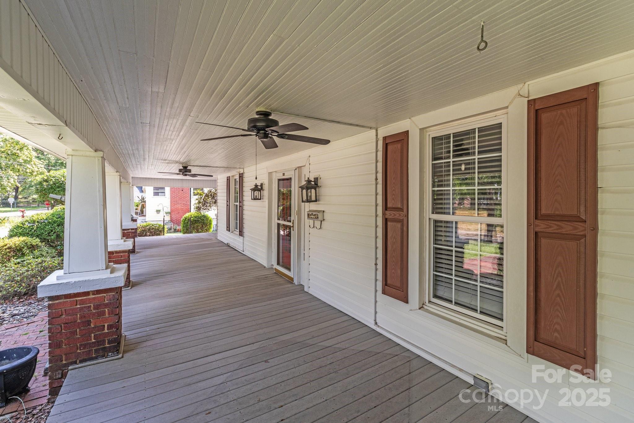 405 7th Street Spencer, NC 28159 - Photo 30 of 39 a view of a porch with wooden floor and stairs