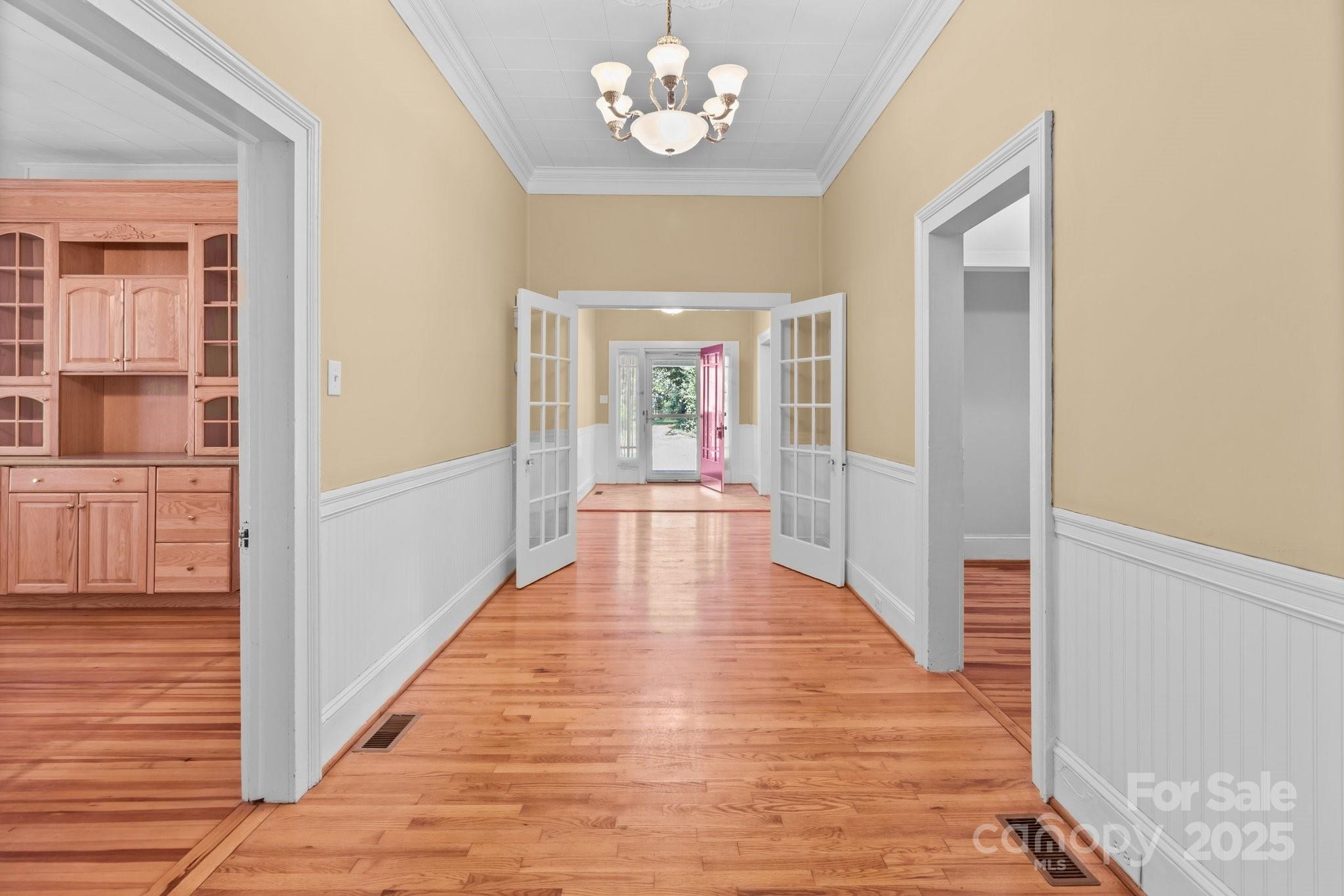 405 7th Street Spencer, NC 28159 - Photo 4 of 39 a view of a hallway with wooden floor