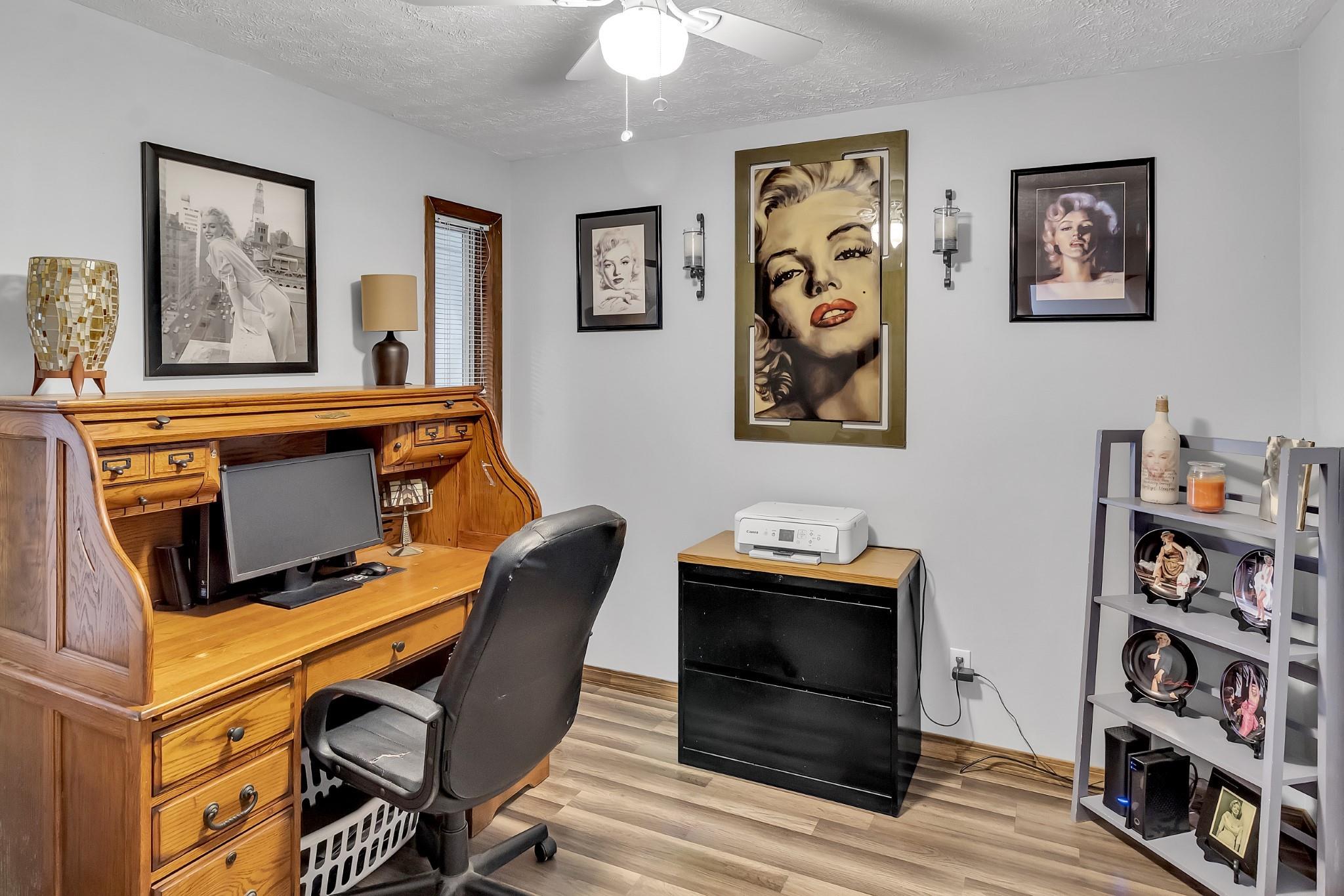 670 Thompson Cove Road Clyde, NC 28721 - Photo 12 of 45 a view of a workspace with furniture and wooden floor