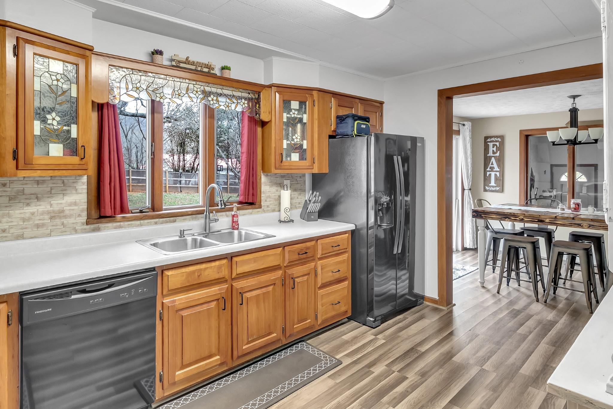 670 Thompson Cove Road Clyde, NC 28721 - Photo 2 of 45 a spacious bathroom with a granite countertop sink and a large mirror
