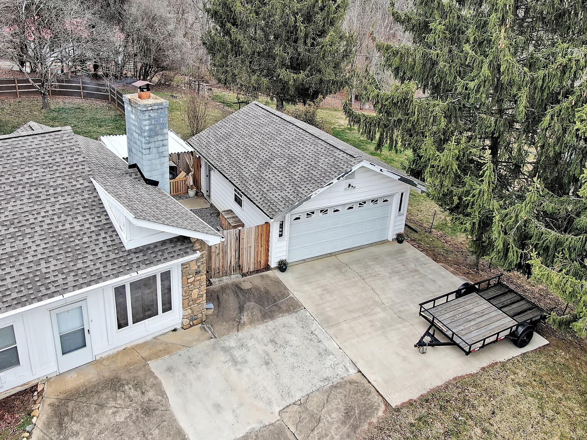 670 Thompson Cove Road Clyde, NC 28721 - Photo 43 of 45 an aerial view of a house with roof yard