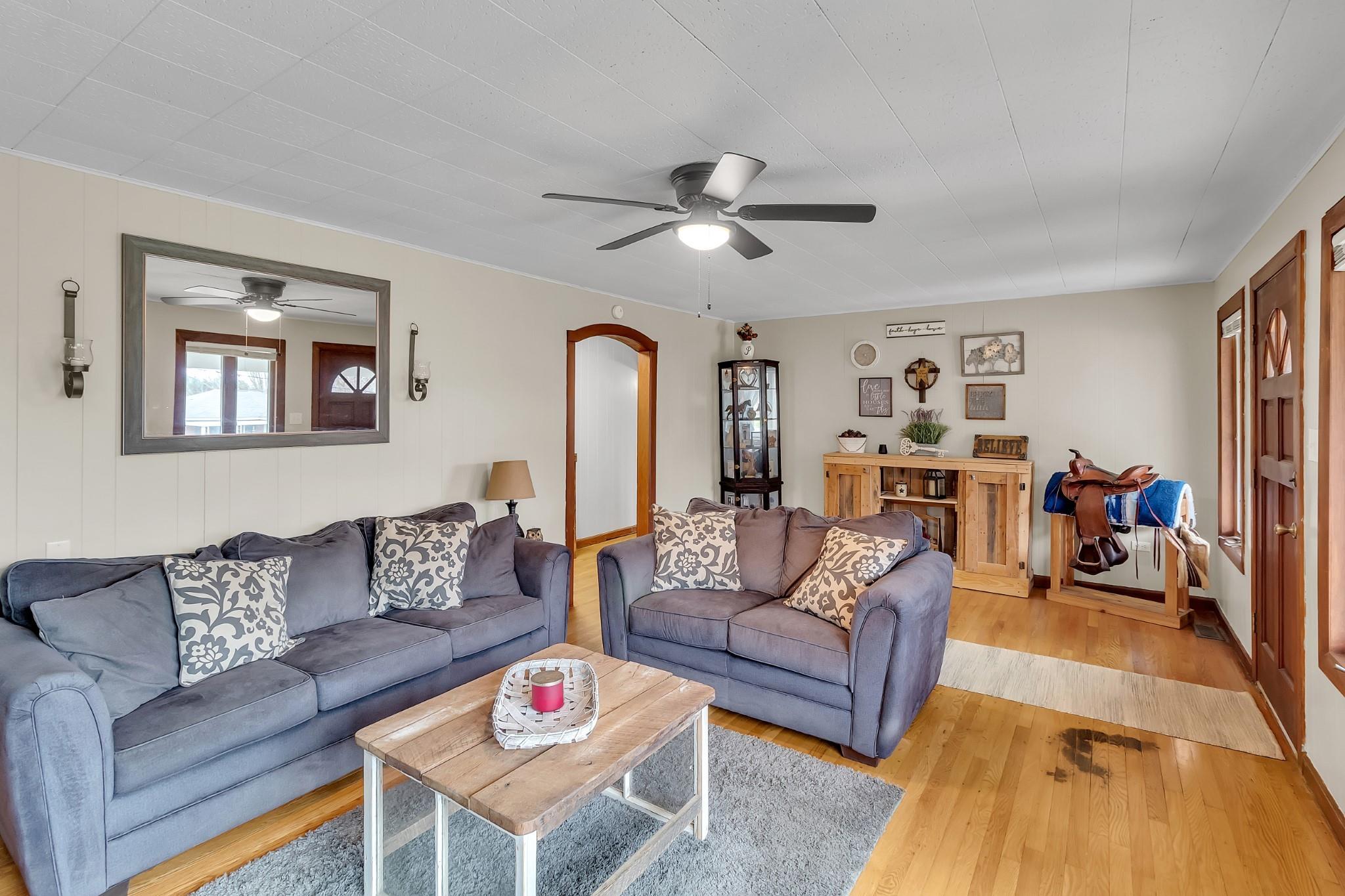 670 Thompson Cove Road Clyde, NC 28721 - Photo 10 of 45 a living room with furniture and a dining table