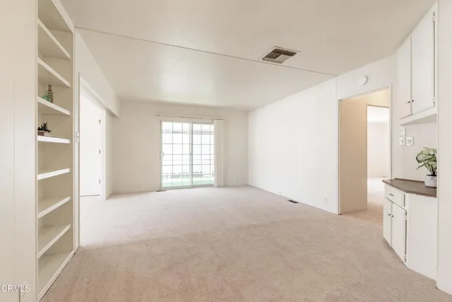 a white toilet sitting next to a shower