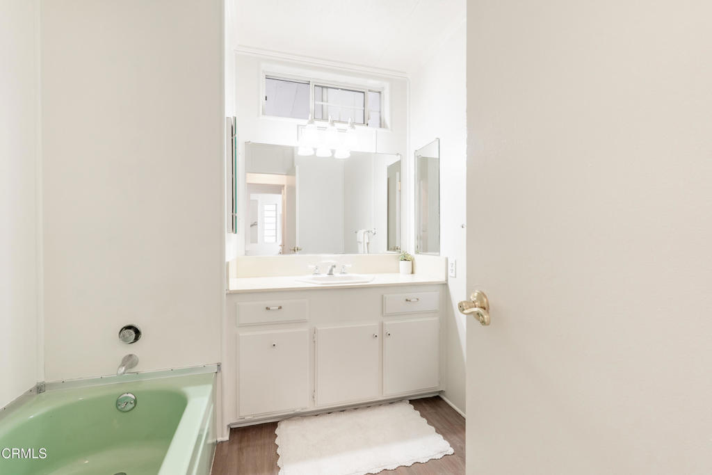 1202 Loma Drive, Unit 42 Ojai, CA 93023 - Photo 17 of 28 a bathroom with a tub sink and mirror