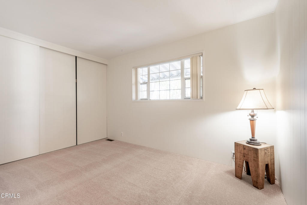 1202 Loma Drive, Unit 42 Ojai, CA 93023 - Photo 19 of 28 a view of empty room with window and lamp