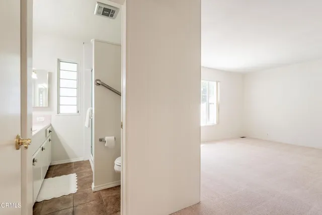 a bathroom with a toilet and a tub