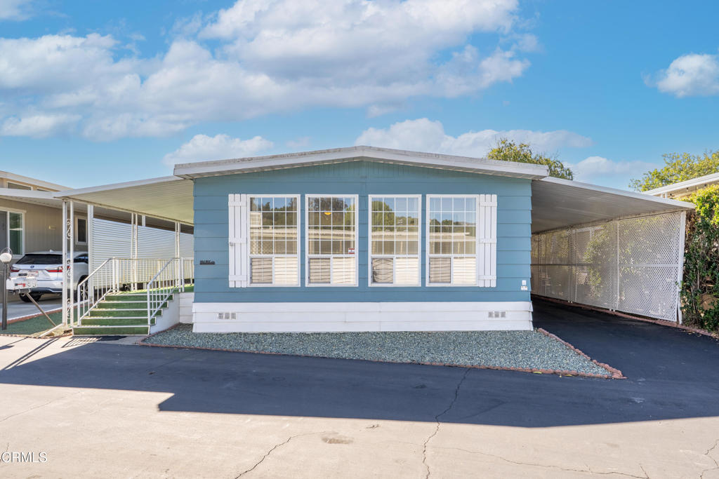 1202 Loma Drive, Unit 42 Ojai, CA 93023 - Photo 2 of 28 a front view of a house with a yard