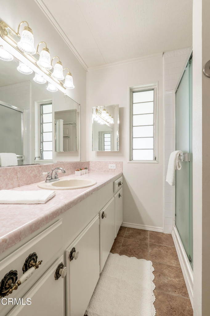 1202 Loma Drive, Unit 42 Ojai, CA 93023 - Photo 22 of 28 a spacious bathroom with a granite countertop sink mirror and a bathtub