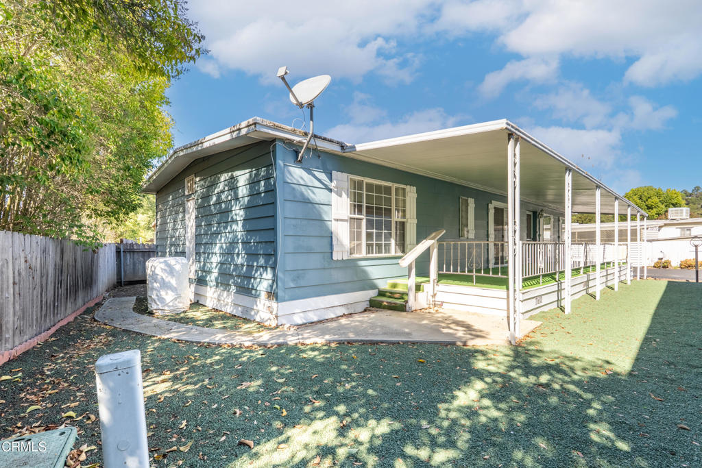 1202 Loma Drive, Unit 42 Ojai, CA 93023 - Photo 27 of 28 a backyard of a house with table and chairs