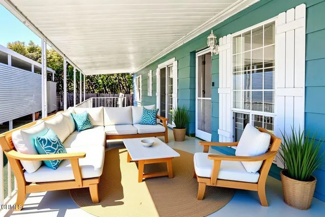 a outdoor space with patio the couches and a dining table with garden view