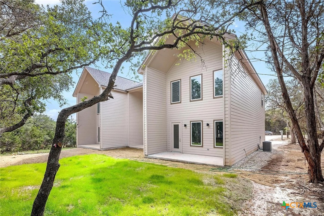 155 North Rip Ford Road, Unit B Spring Branch, TX 78070 - Photo 17 of 17 a view of a house with a yard