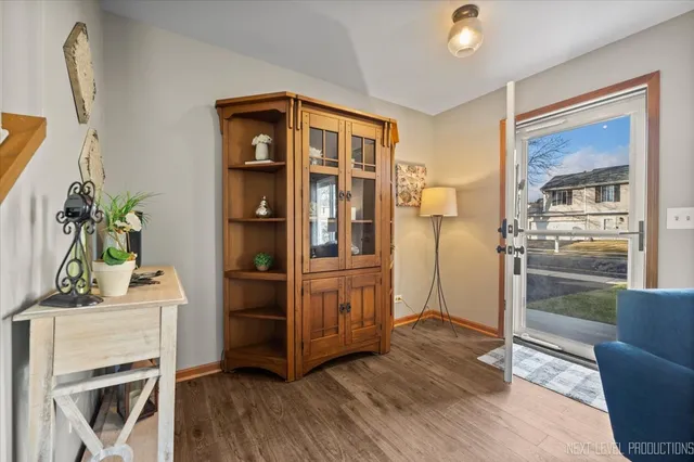 a kitchen with a refrigerator and a stove top oven