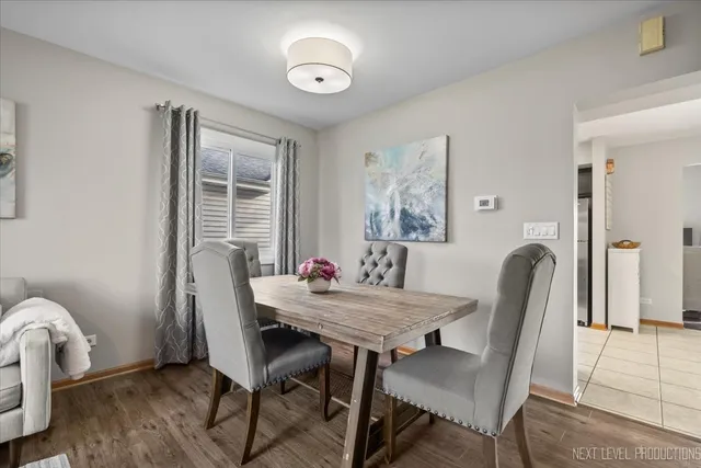 a dining room with furniture and window