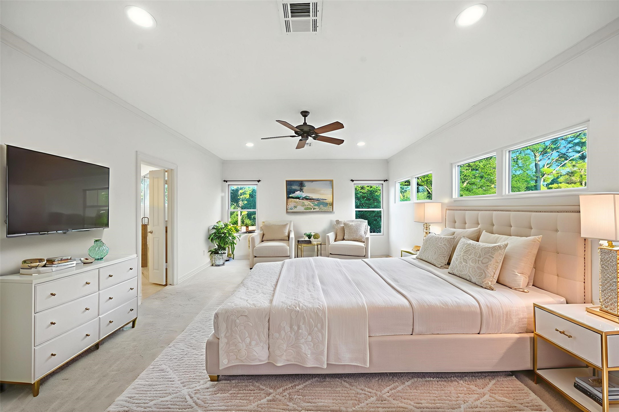 2714 Stuart Manor Houston, TX 77082 - Photo 25 of 49 Image is Virtually Staged - The spacious primary bedroom impresses with soaring ceilings, recessed lighting, and a wall of windows that invite in natural light while maintaining privacy.