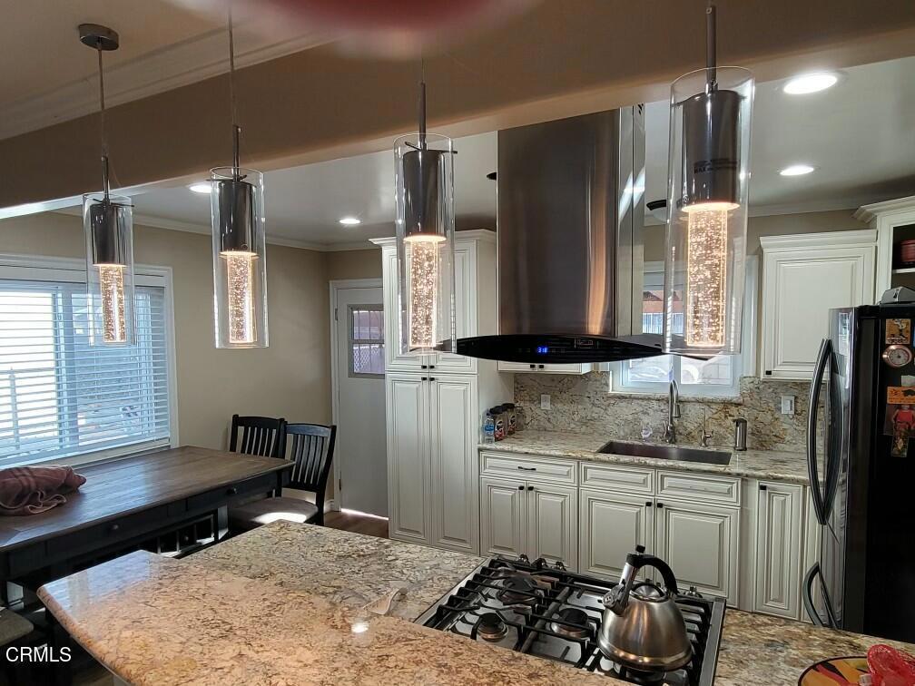 1440 Morris Street Oxnard, CA 93030 - Photo 4 of 7 a kitchen with sink refrigerator and stove