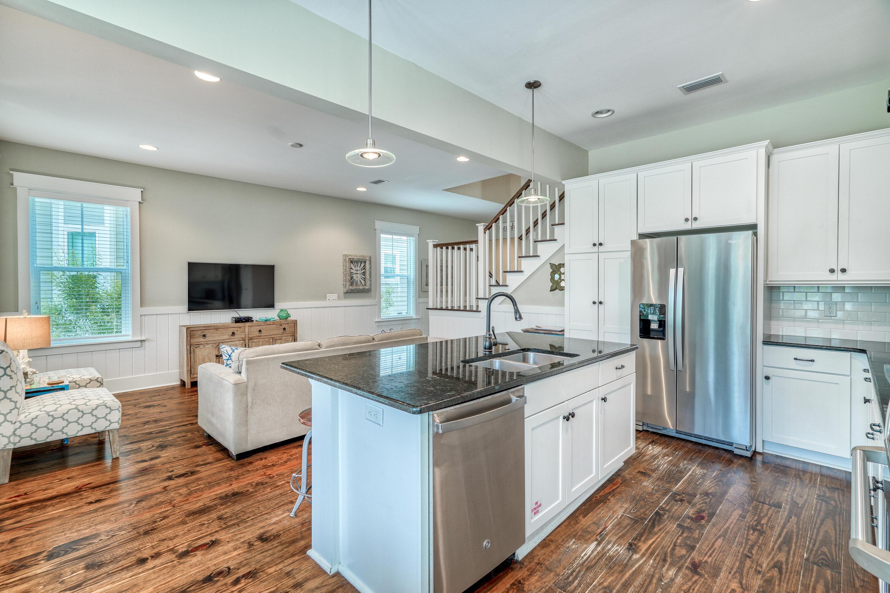985 Sandgrass Boulevard Santa Rosa Beach, FL 32459 - Photo 15 of 65 a kitchen with a sink stove and refrigerator