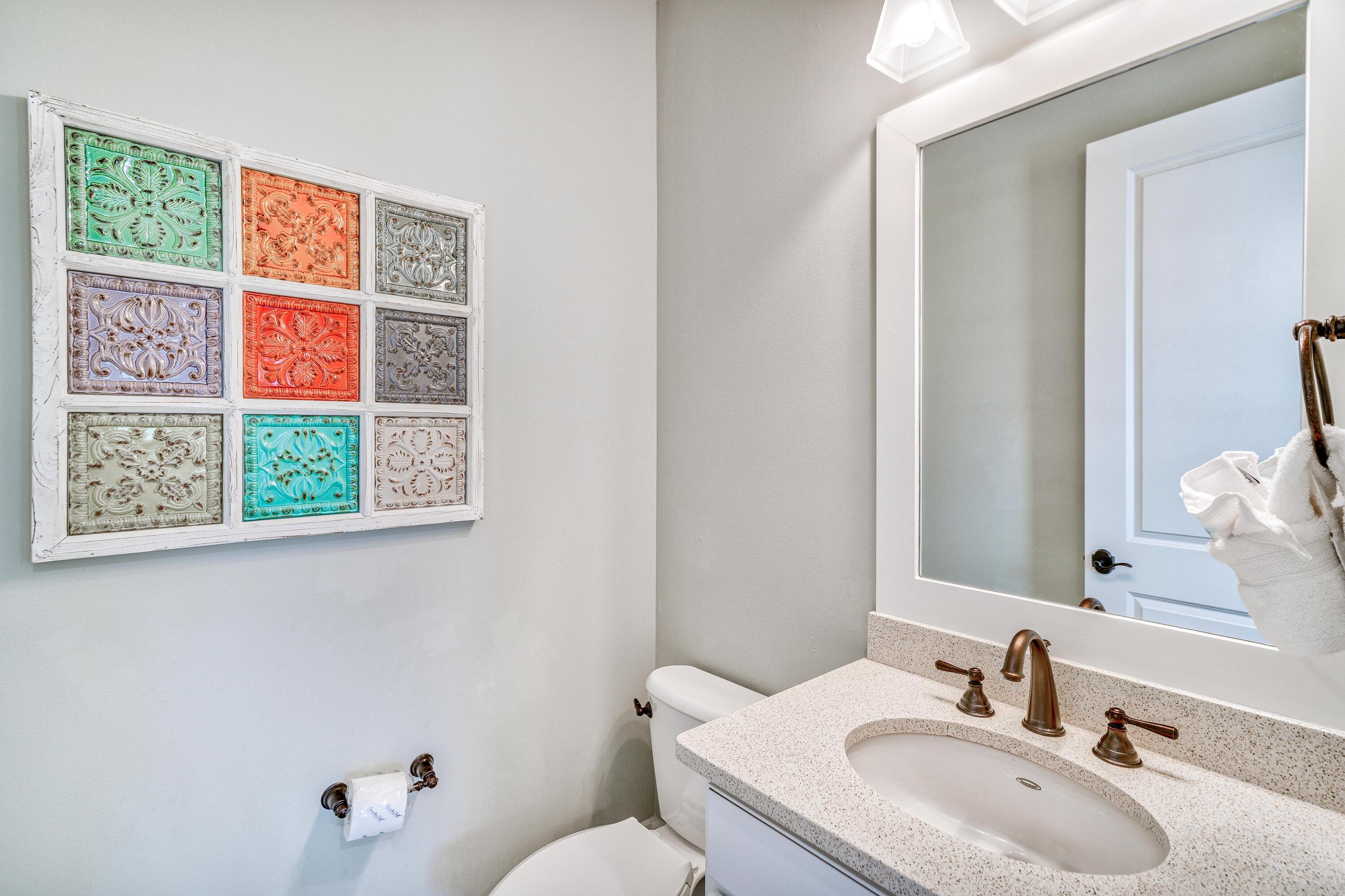 985 Sandgrass Boulevard Santa Rosa Beach, FL 32459 - Photo 16 of 65 a bathroom with a sink and a toilet