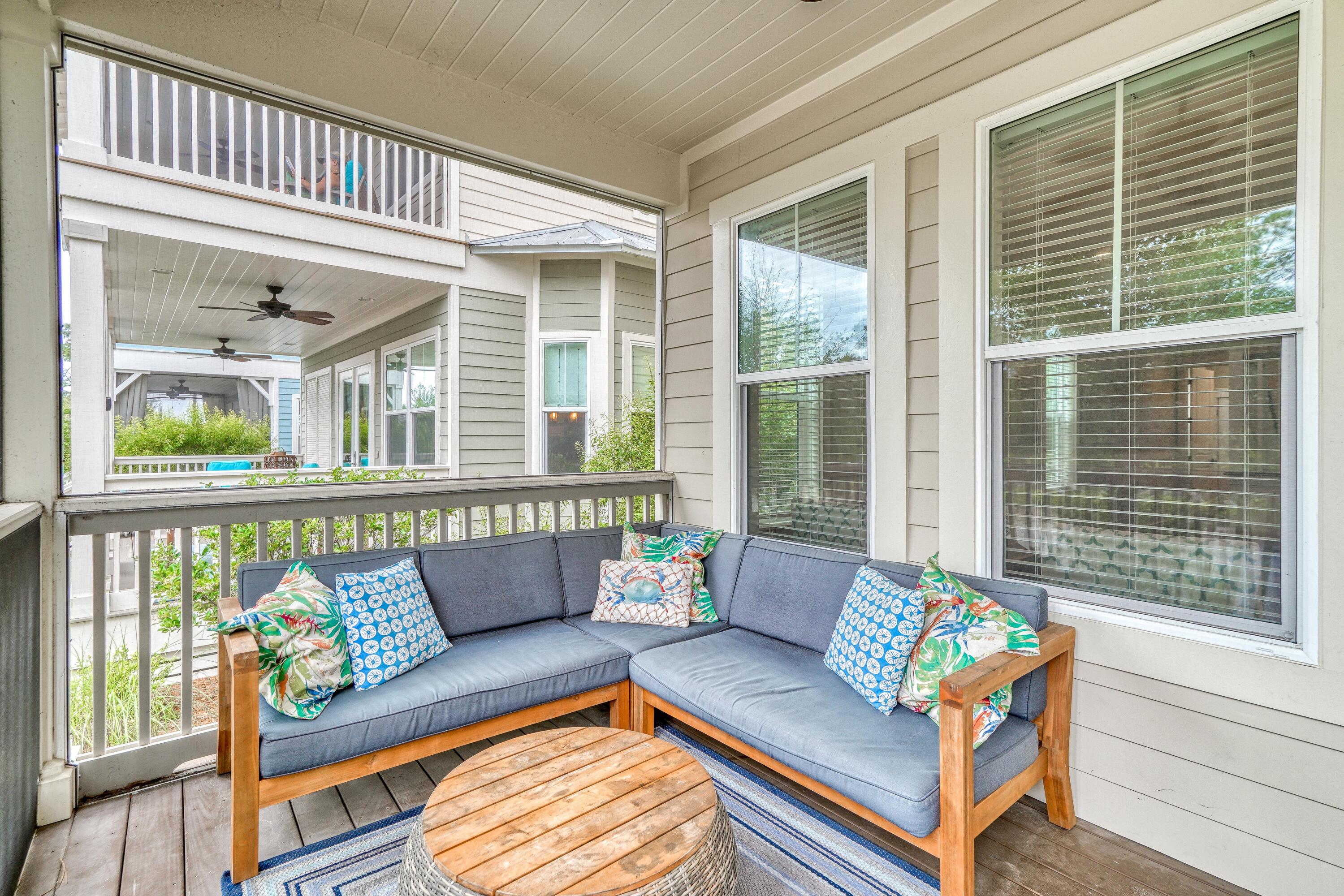 985 Sandgrass Boulevard Santa Rosa Beach, FL 32459 - Photo 23 of 65 a living room with furniture and a large window