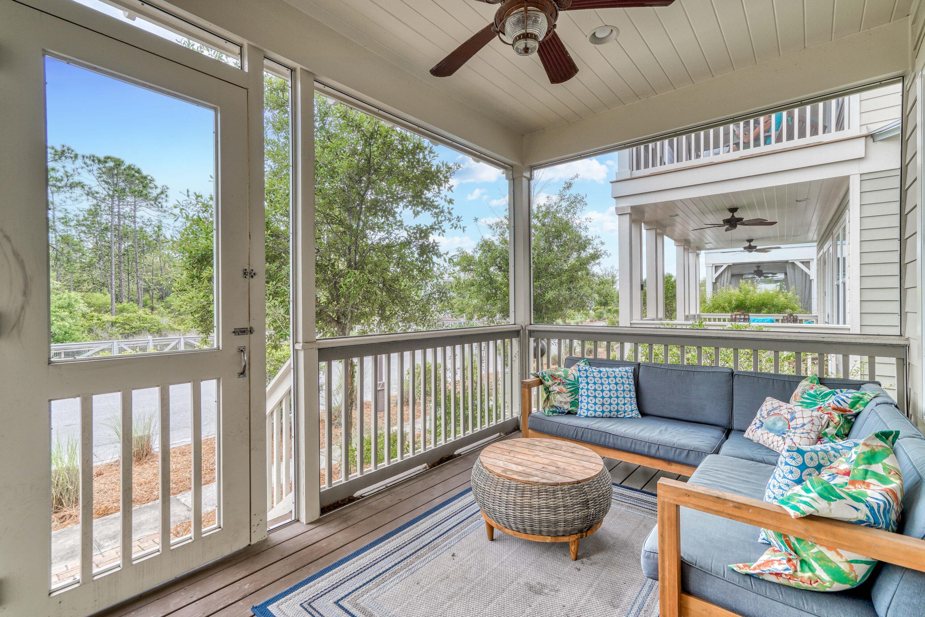 985 Sandgrass Boulevard Santa Rosa Beach, FL 32459 - Photo 24 of 65 a living room with furniture and a large window