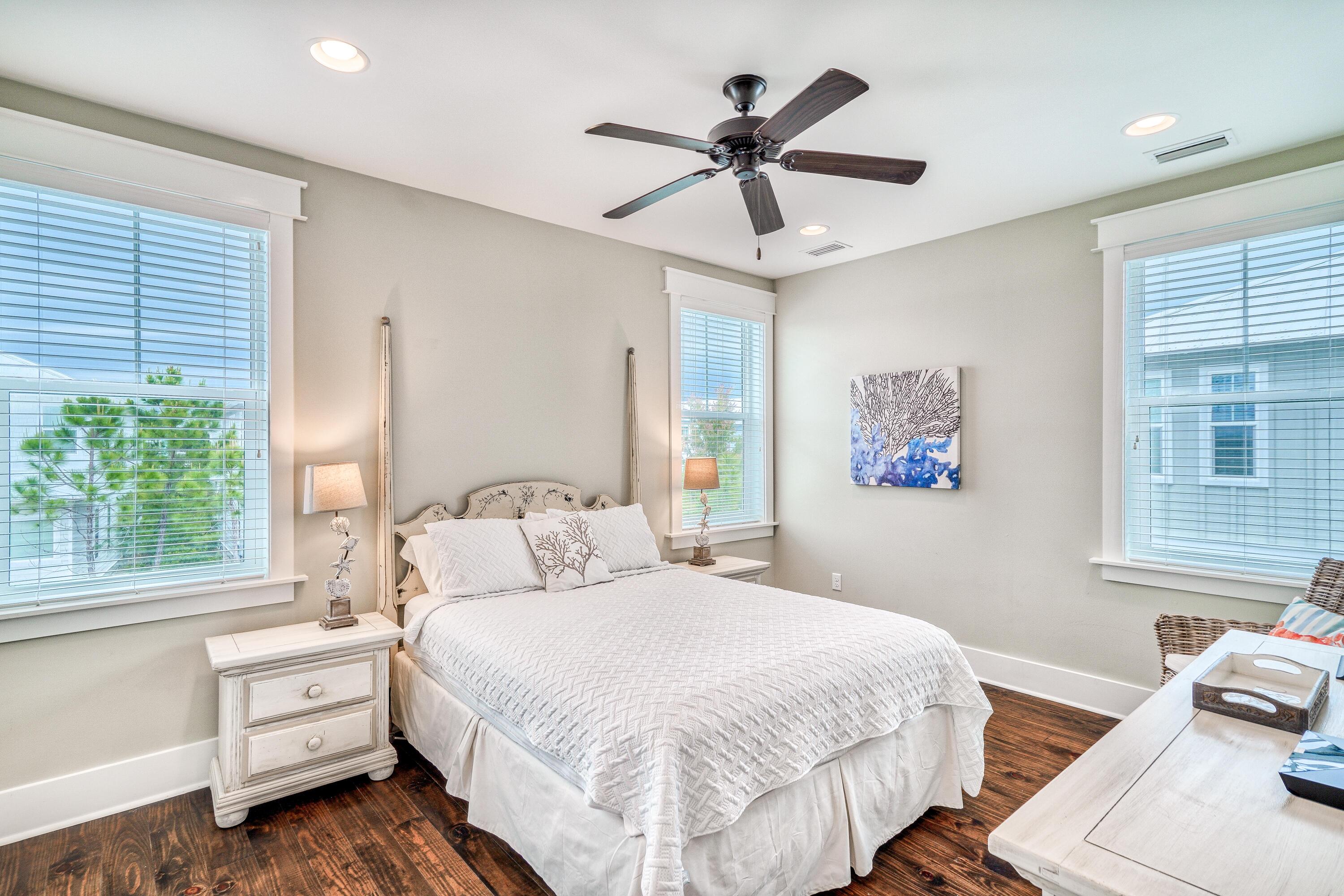 985 Sandgrass Boulevard Santa Rosa Beach, FL 32459 - Photo 36 of 65 a bedroom with a large bed and a window