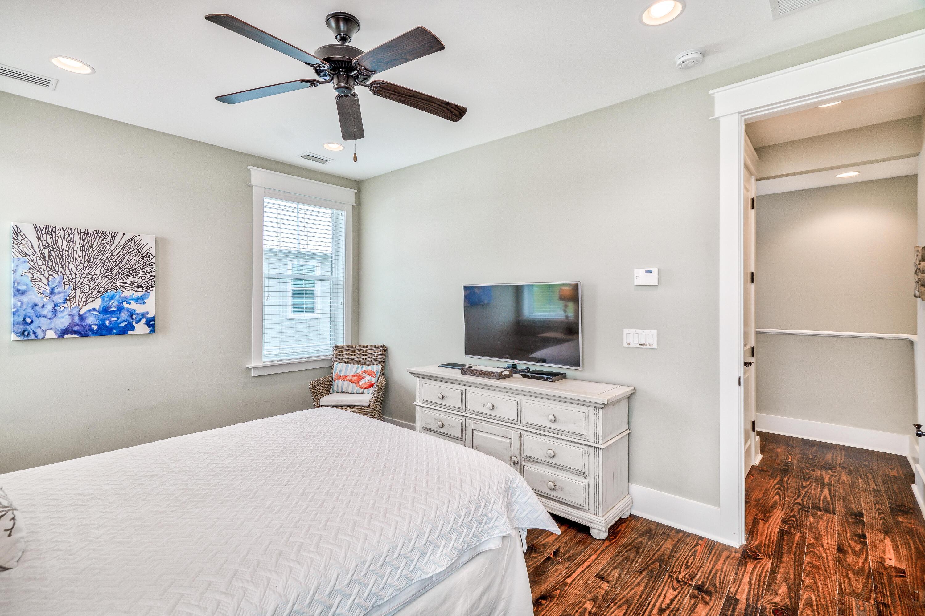 985 Sandgrass Boulevard Santa Rosa Beach, FL 32459 - Photo 37 of 65 a bedroom with a bed and a flat screen tv