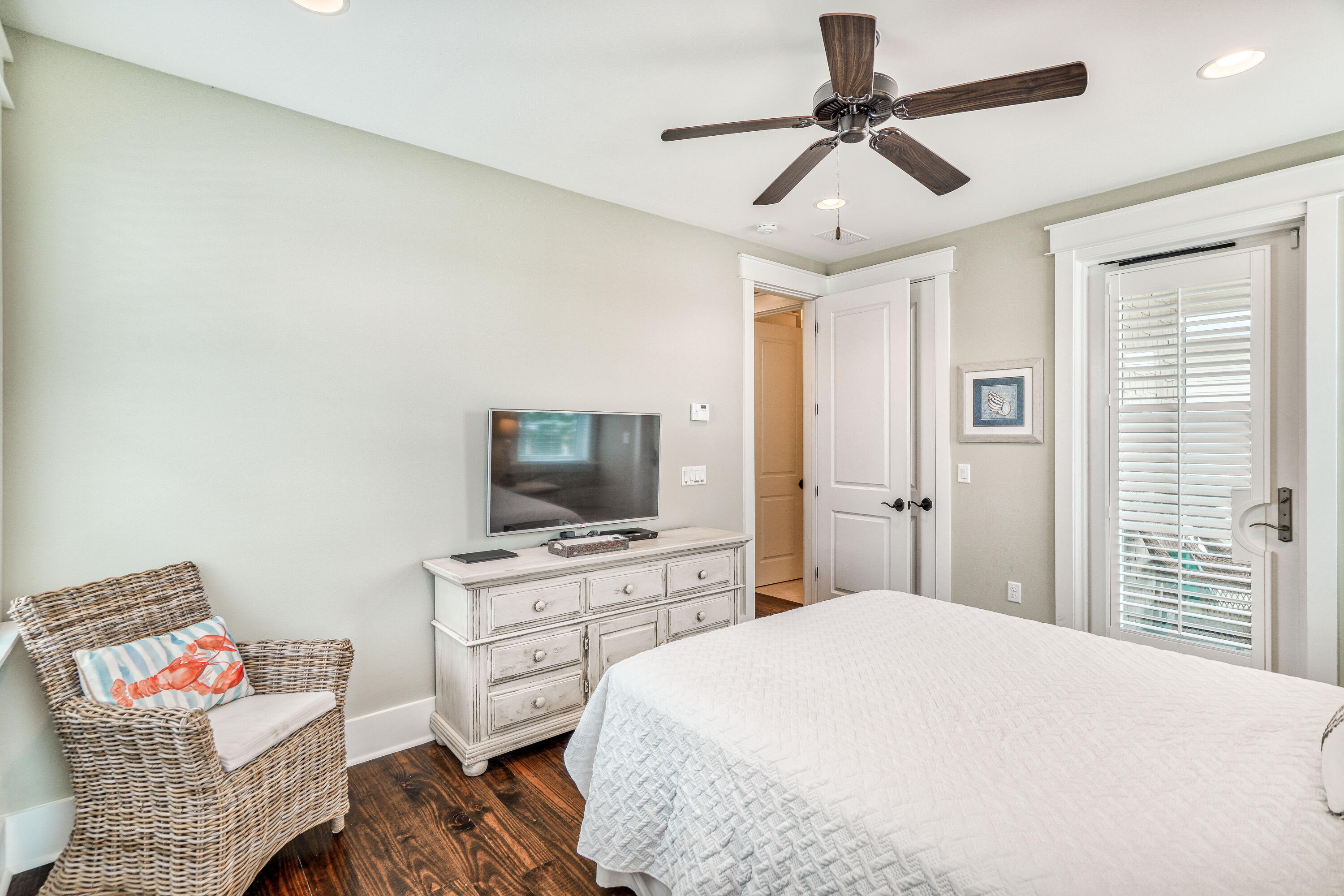 985 Sandgrass Boulevard Santa Rosa Beach, FL 32459 - Photo 38 of 65 a bedroom with a bed and a television