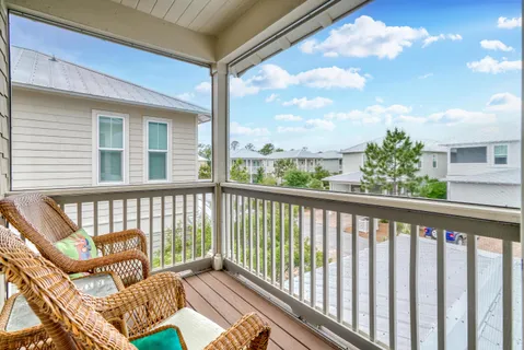 a view of a house with backyard porch and sitting area