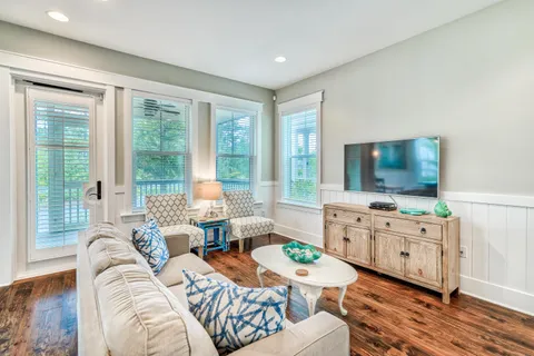 a living room with furniture and a flat screen tv