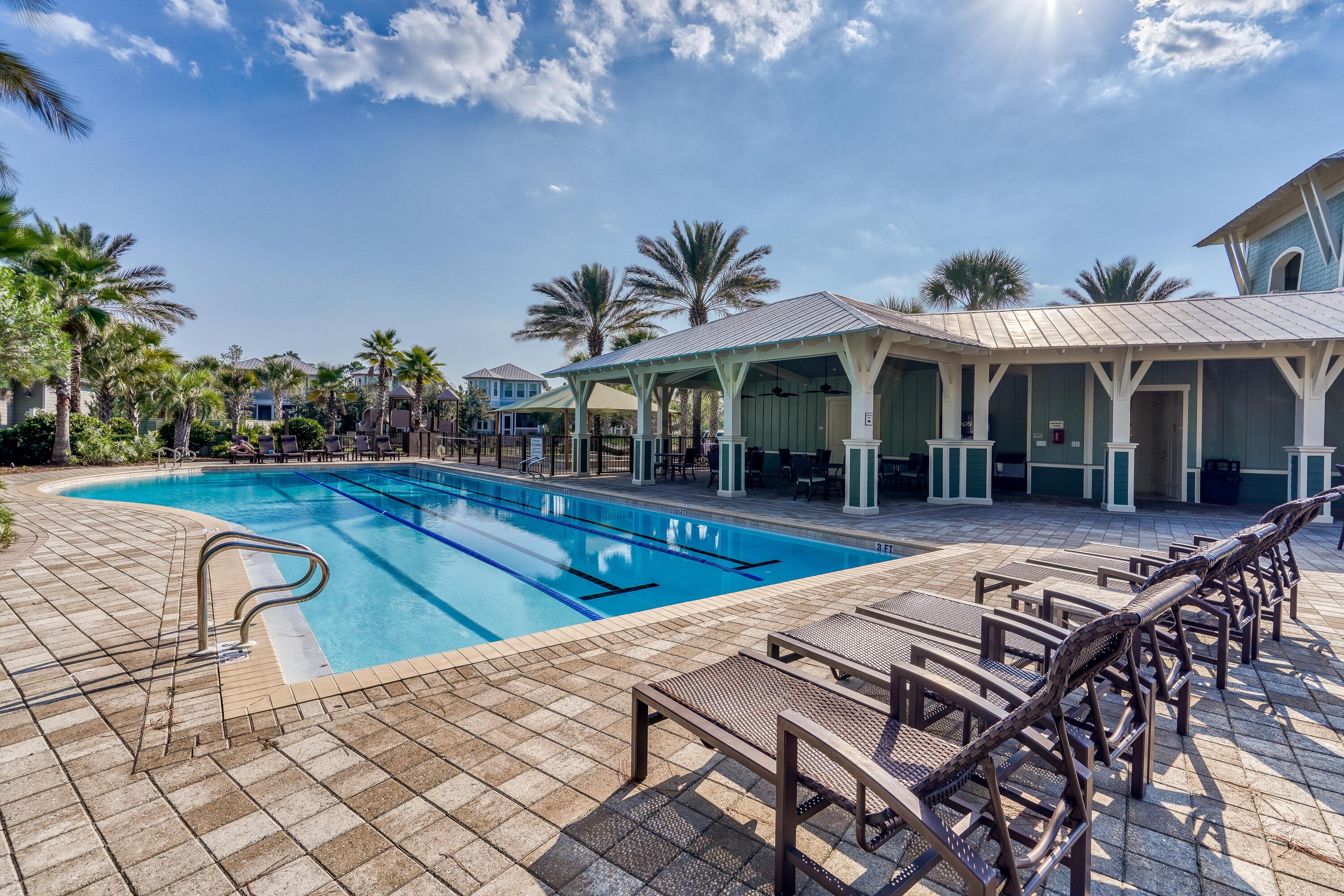 985 Sandgrass Boulevard Santa Rosa Beach, FL 32459 - Photo 53 of 65 a view of a patio with swimming pool table and chairs
