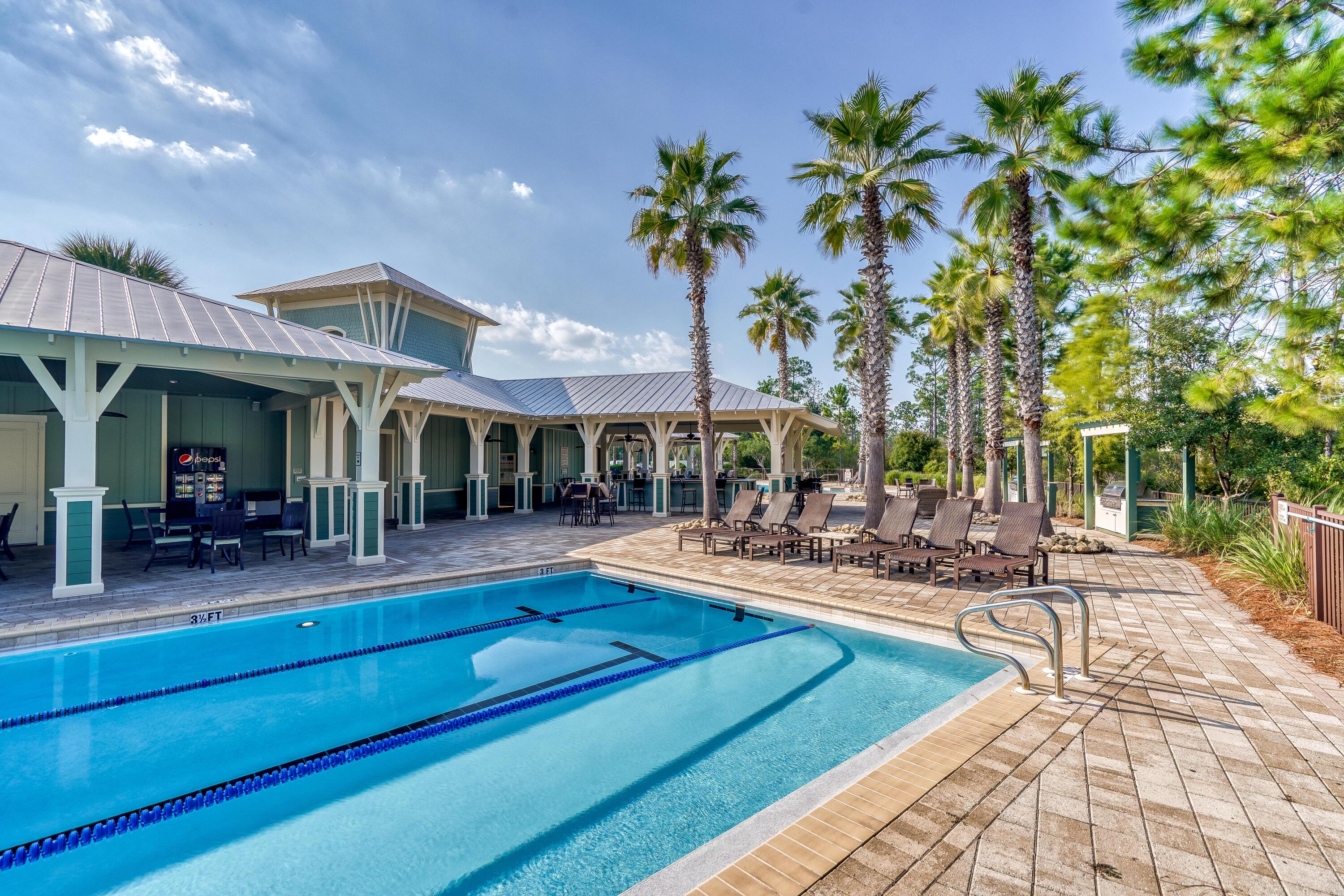 985 Sandgrass Boulevard Santa Rosa Beach, FL 32459 - Photo 54 of 65 a view of a house with sitting area and swimming pool