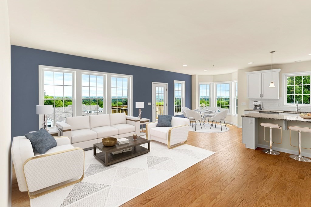 57 Sienna Circle, Unit 44 Upton, MA 01568 - Photo 12 of 21 a living room with furniture and a large window