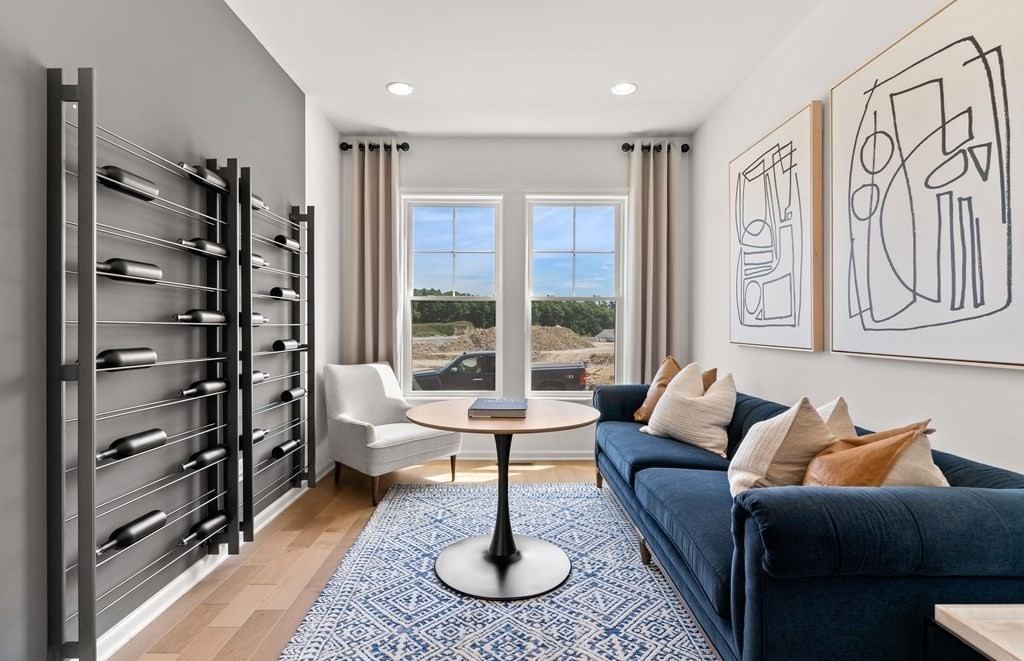 57 Sienna Circle, Unit 44 Upton, MA 01568 - Photo 13 of 21 a living room with furniture large window and a flat screen tv