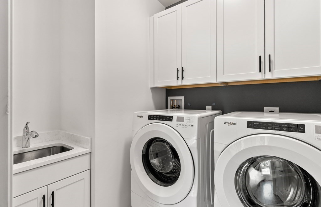 57 Sienna Circle, Unit 44 Upton, MA 01568 - Photo 17 of 21 a utility room with dryer and washer