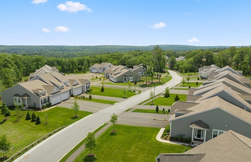 57 Sienna Circle, Unit 44 Upton, MA 01568 - Photo 2 of 21 an aerial view of a house with swimming pool and garden