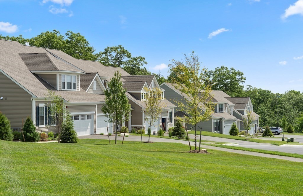57 Sienna Circle, Unit 44 Upton, MA 01568 - Photo 3 of 21 a front view of a house with a yard