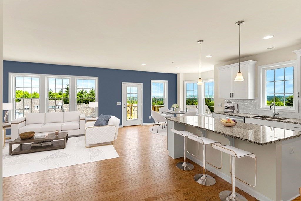 57 Sienna Circle, Unit 44 Upton, MA 01568 - Photo 7 of 21 a large kitchen with kitchen island a large window in it