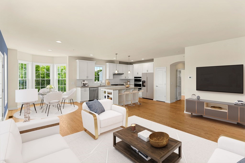 57 Sienna Circle, Unit 44 Upton, MA 01568 - Photo 10 of 21 a living room with furniture and a flat screen tv