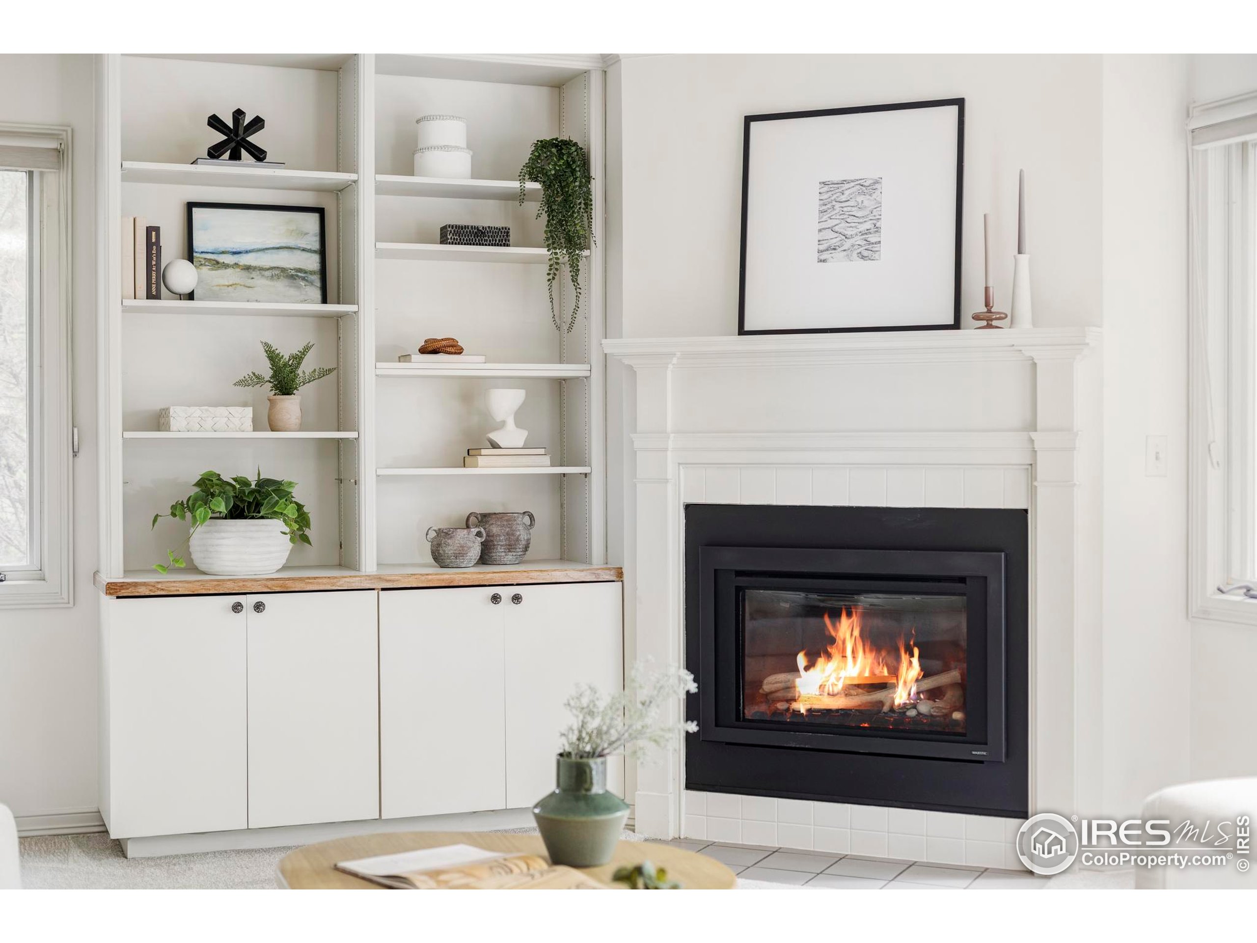 2672 Winding Trail Drive Boulder, CO 80304 - Photo 12 of 31 a living room with painting on the wall and a fireplace