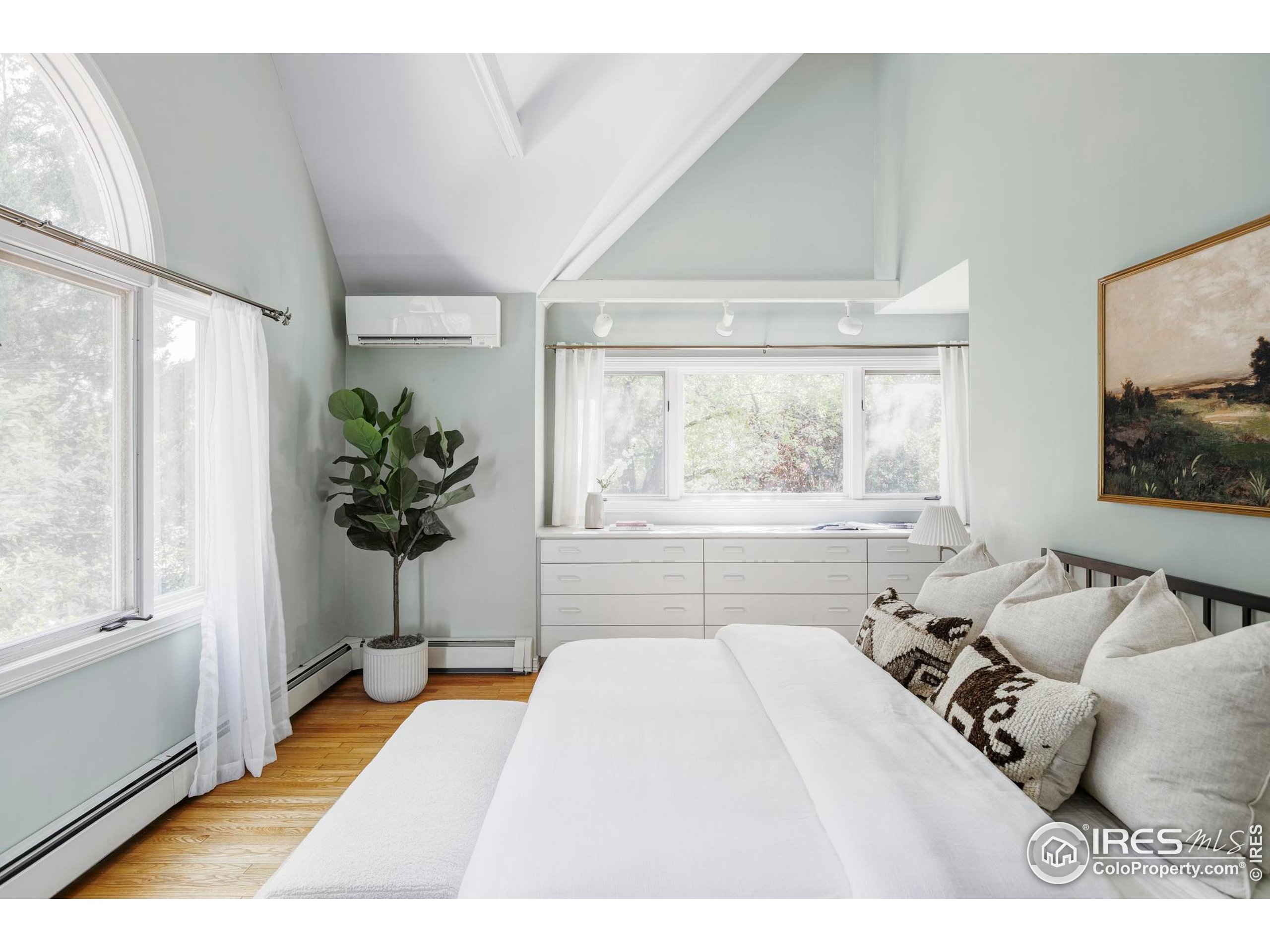 2672 Winding Trail Drive Boulder, CO 80304 - Photo 24 of 31 a spacious bedroom with a large bed and a window