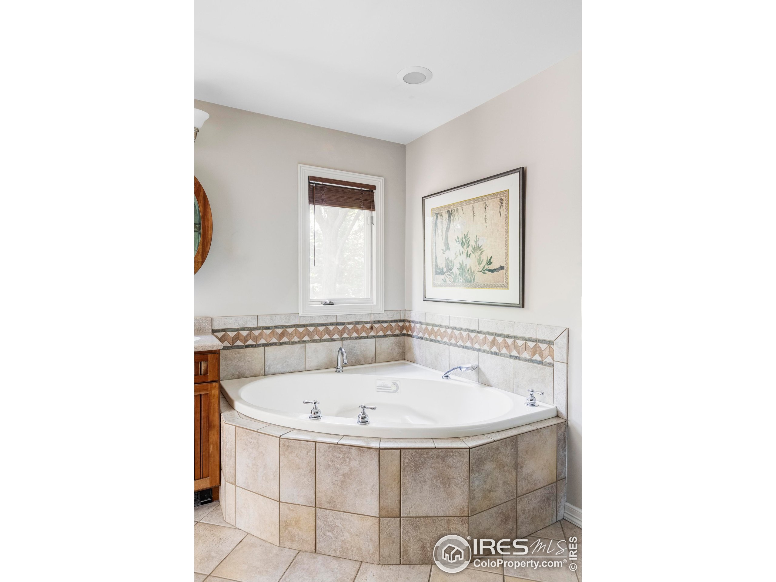 2672 Winding Trail Drive Boulder, CO 80304 - Photo 26 of 31 a white bath tub sitting in a bathroom