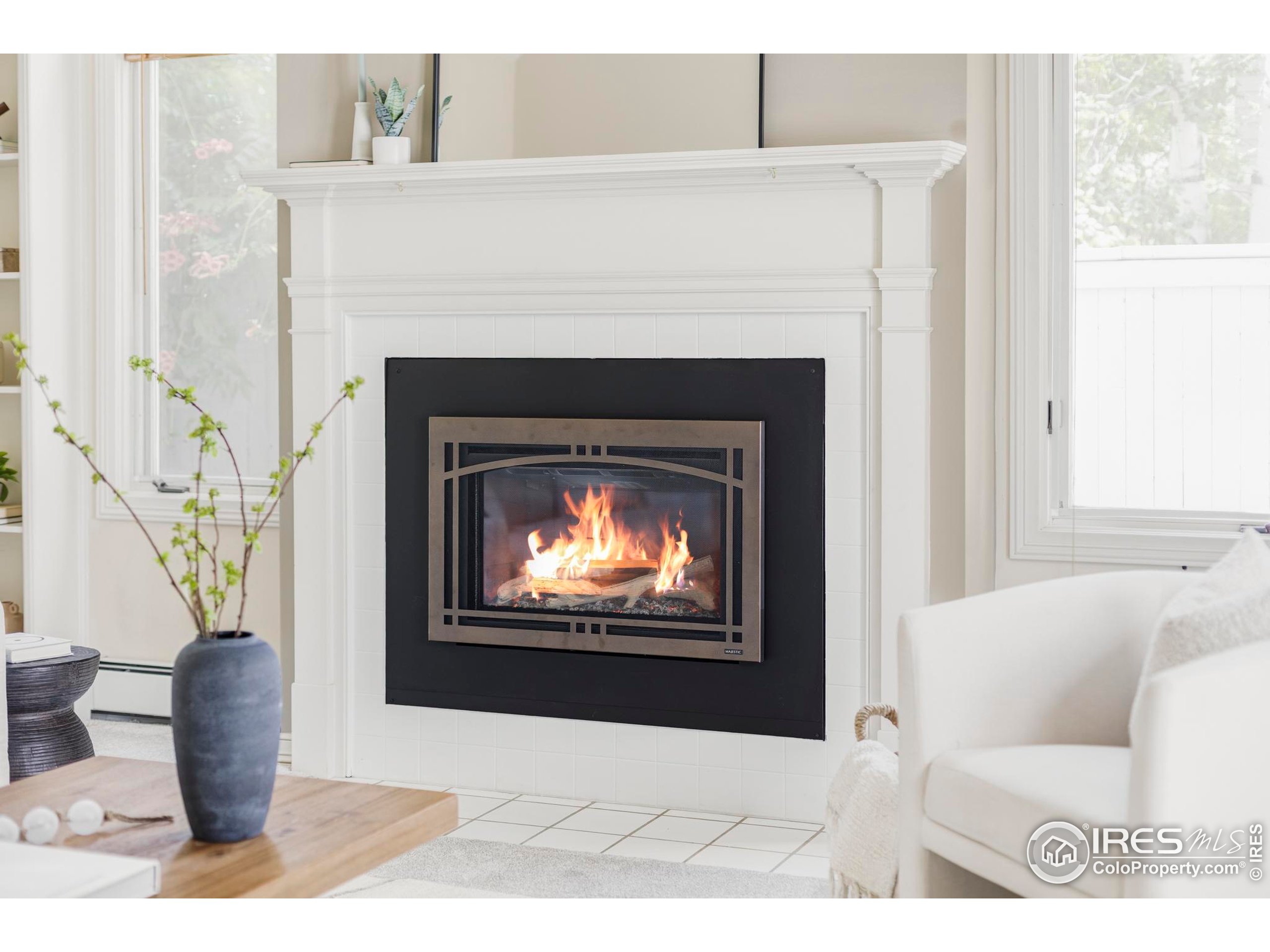 2672 Winding Trail Drive Boulder, CO 80304 - Photo 6 of 31 a living room with furniture a fireplace and a window