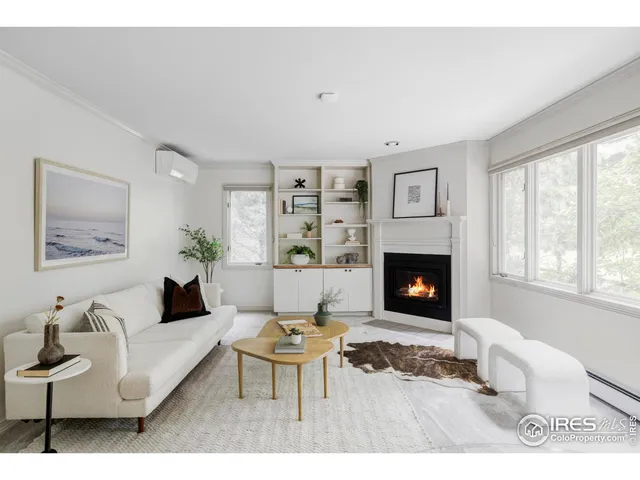 a living room with furniture and potted plant