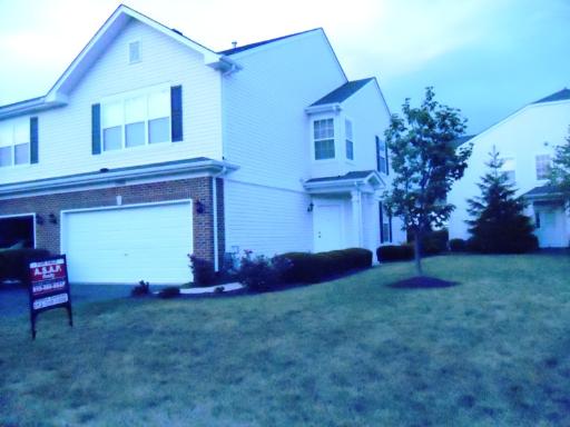 1966 Crestview Circle, Unit 1966 Romeoville, IL 60446 - Photo 1 of 7 a front view of a house with plants