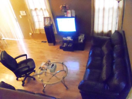 1966 Crestview Circle, Unit 1966 Romeoville, IL 60446 - Photo 6 of 7 a living room with couches chair and a large window with wooden floor