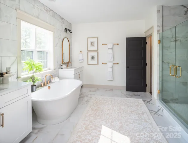 a spacious bathroom with a bathtub and sink